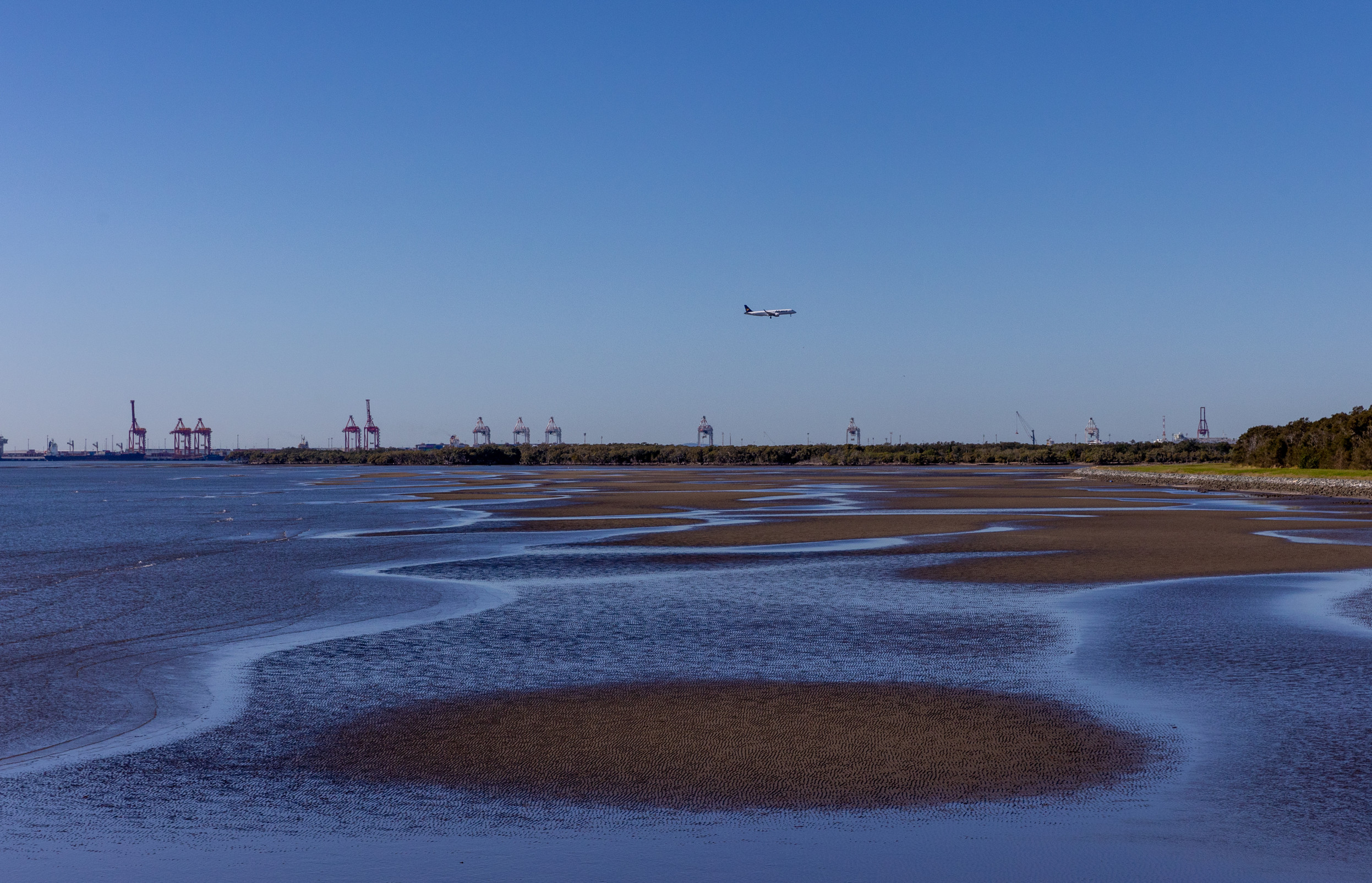 A plane flying over Moreton Bay