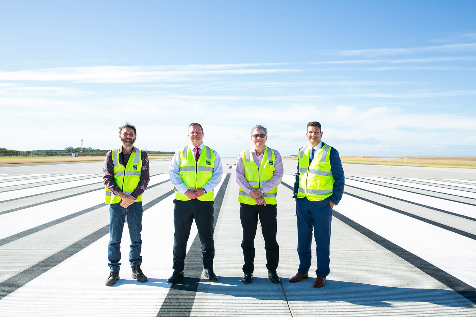 Ben Garnett, Gert-Jan de Graaff, Paul Coughlan and Krishan Tangri on Brisbane's new runway