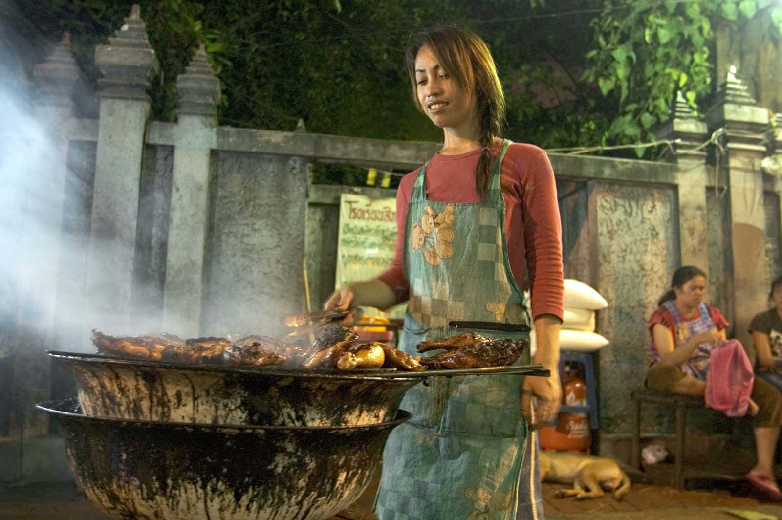Grilling food on the streets of Bangkok, Thailand