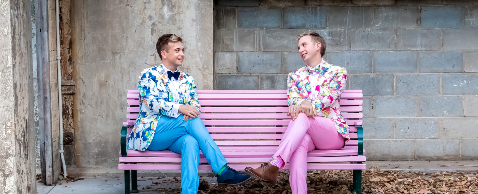 Ben (left) and husband, Jack (right) sitting on pink bench