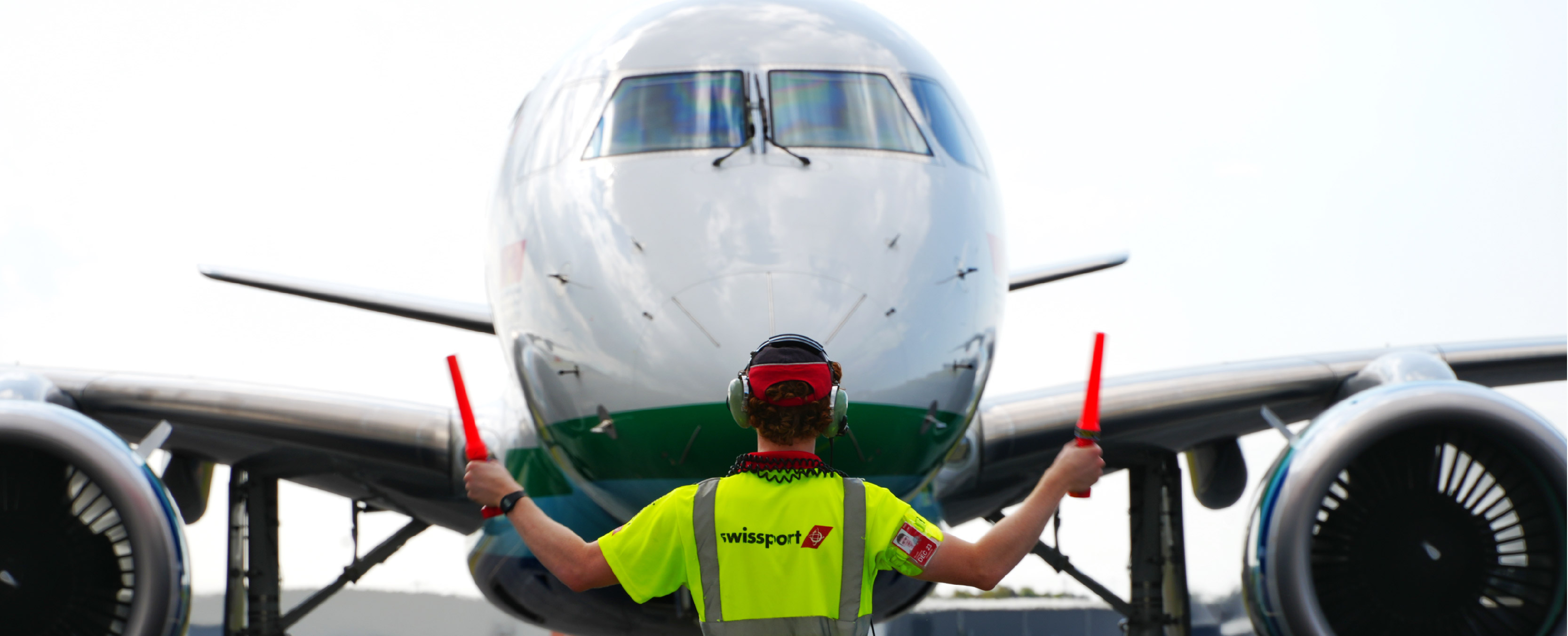 person marshalling plane 