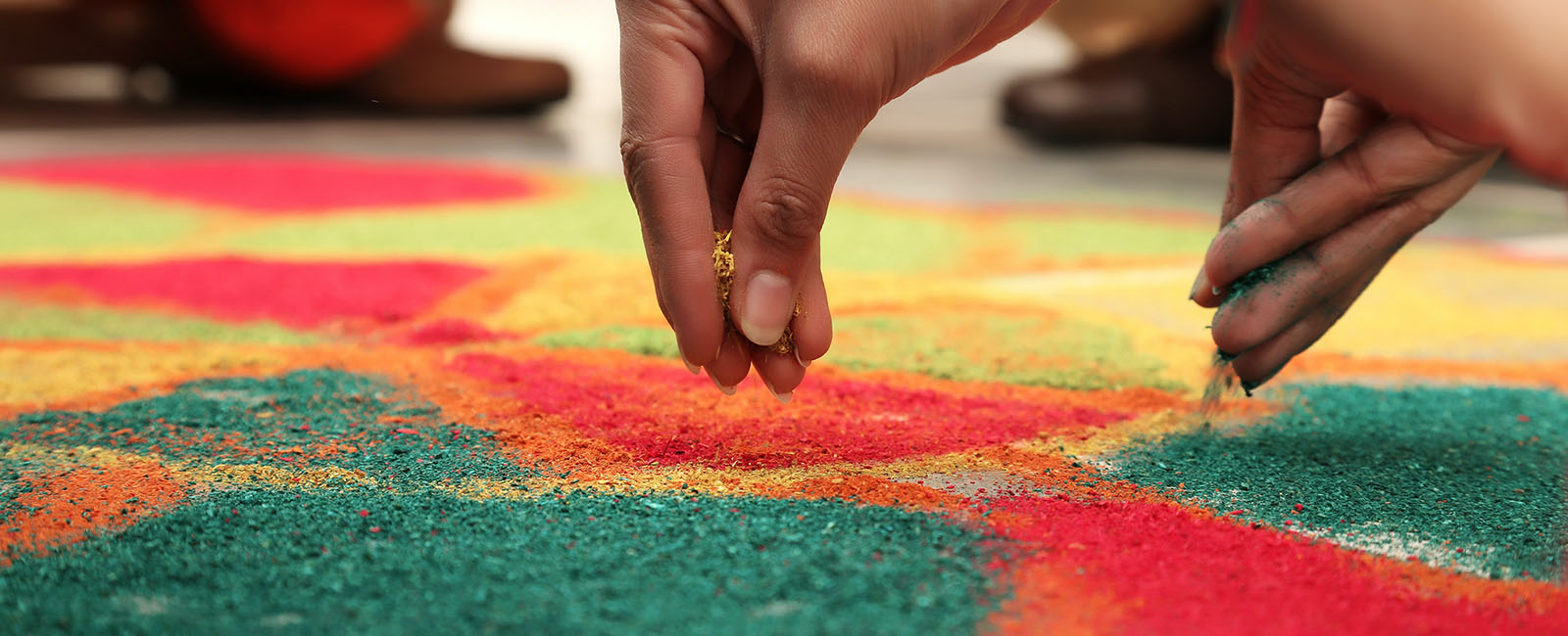 Colourful rangolis decorates the floors outside homes during Diwali