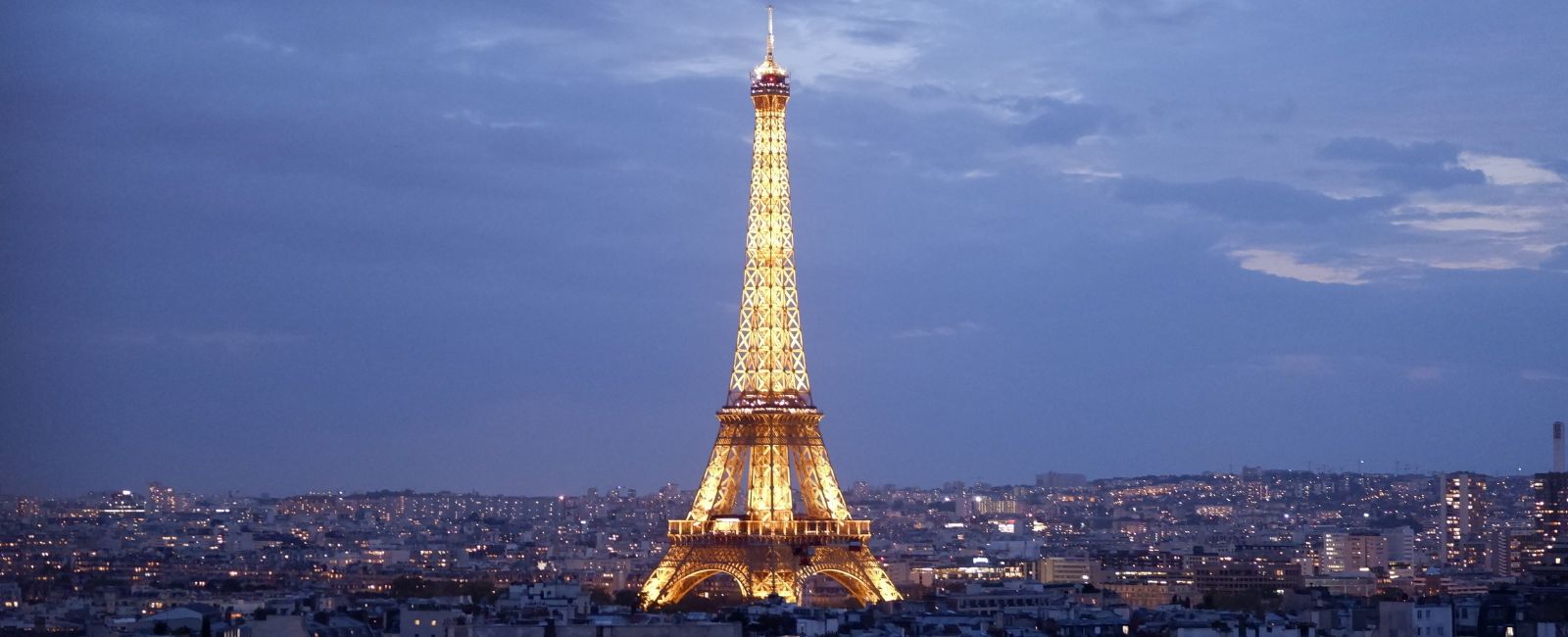 Eiffel Tower sparkles above Paris, France