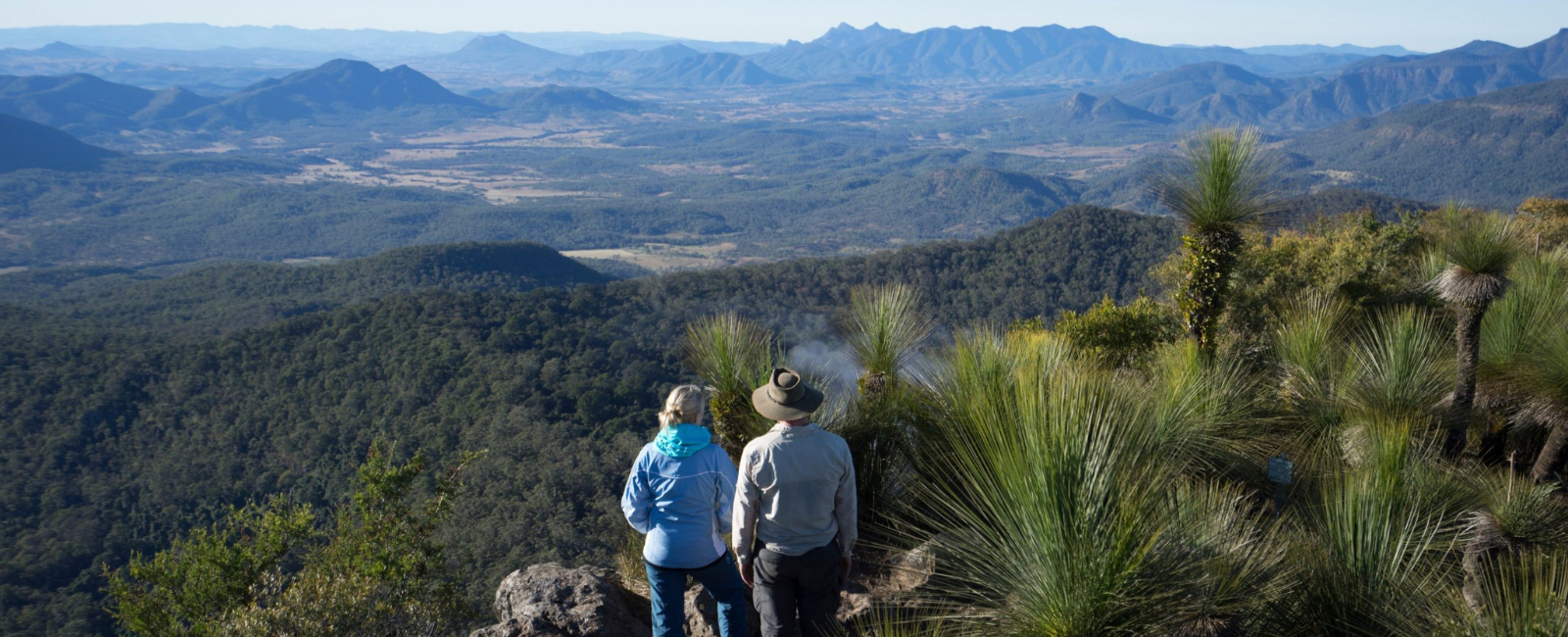 Two people standing on the top of Spicers Peak