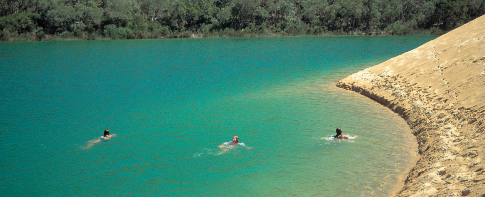 People swimming in Lake Wabby, K'gari