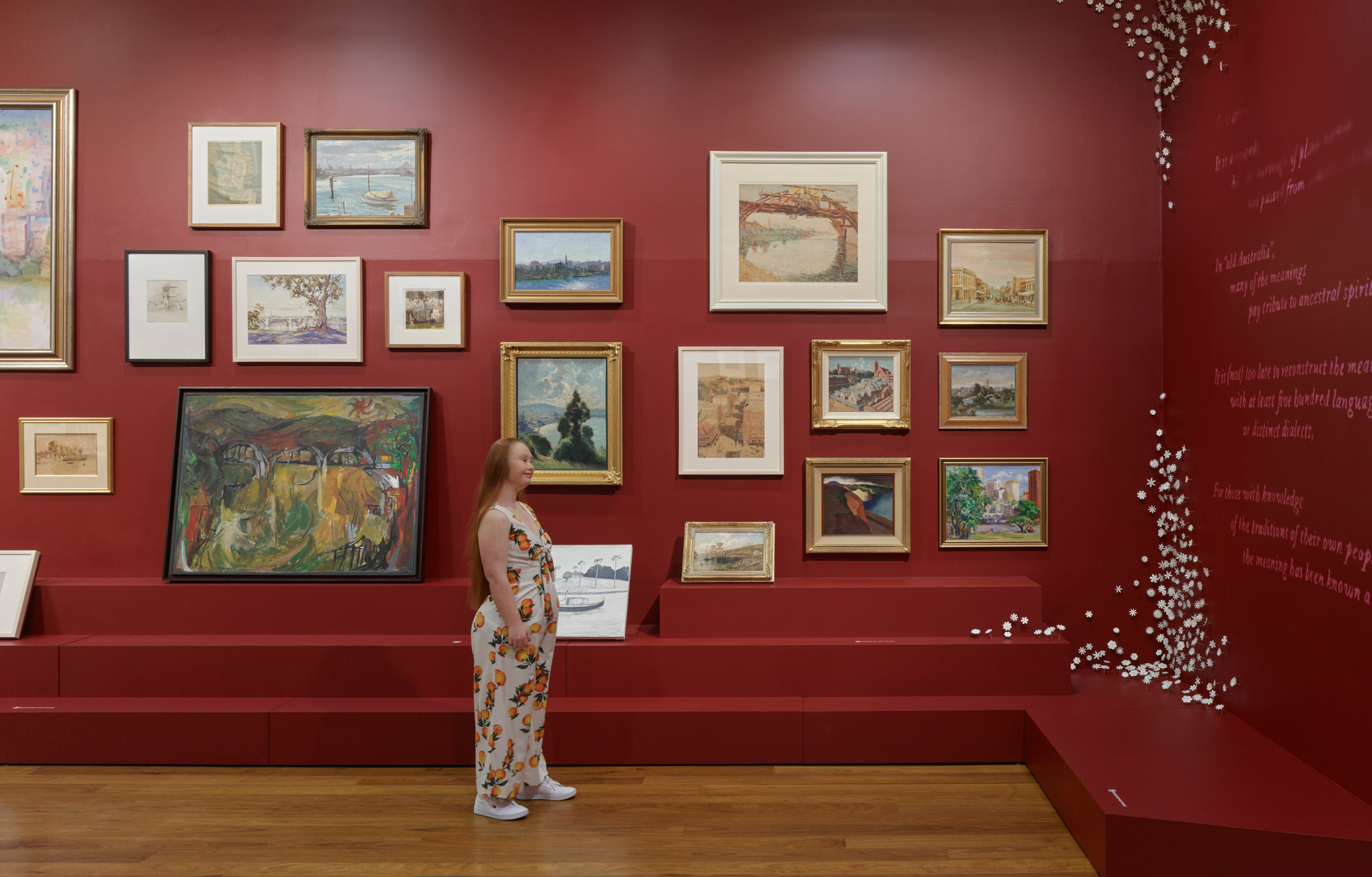 A lady looking at artwork in Museum of Brisbane
