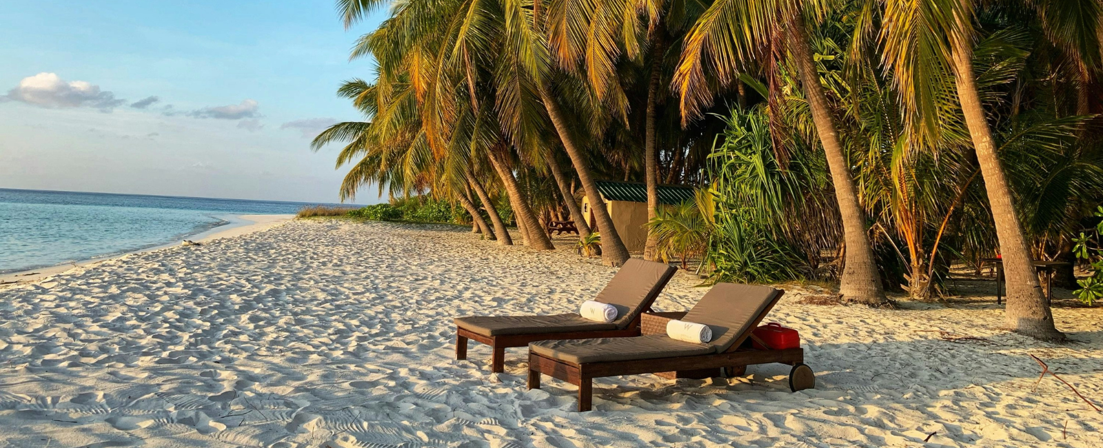 Lounge chairs for a couple on the sand in the Maldives