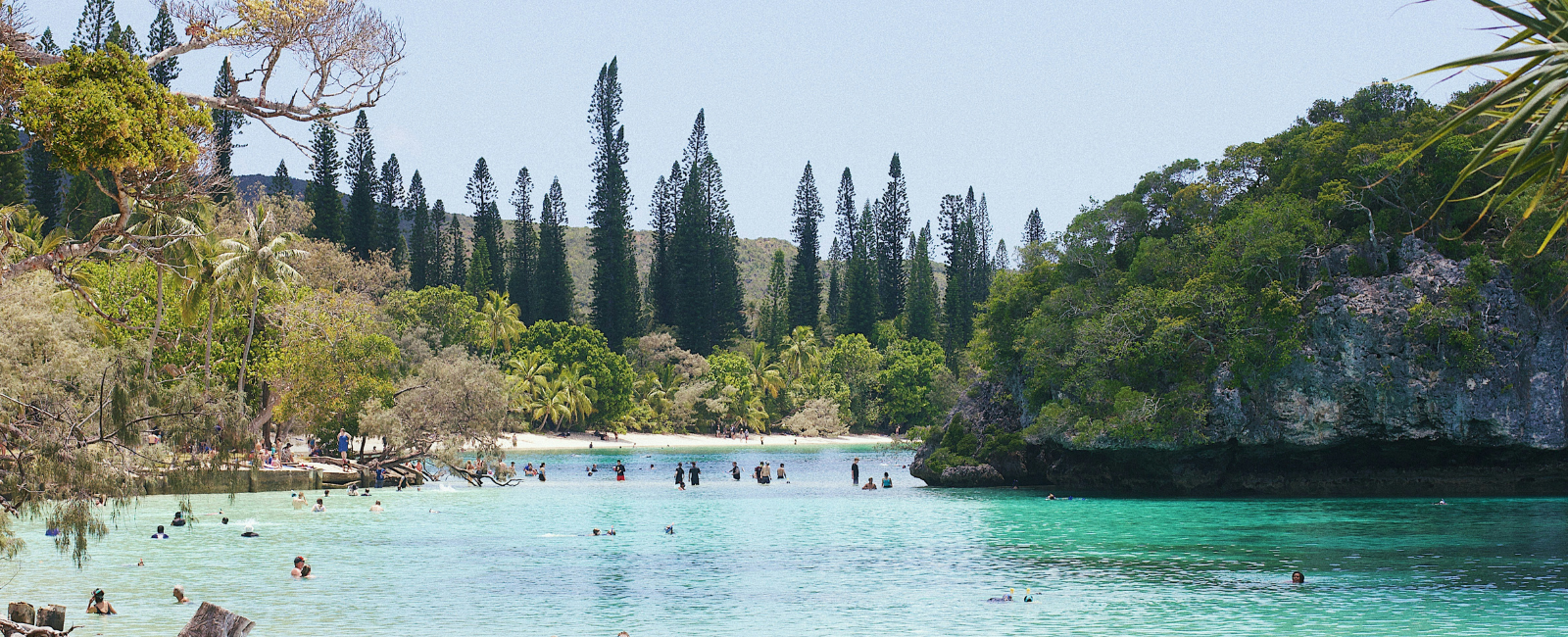 People swimming at Lifou New Caledonia People swimming at Lifou New Caledonia