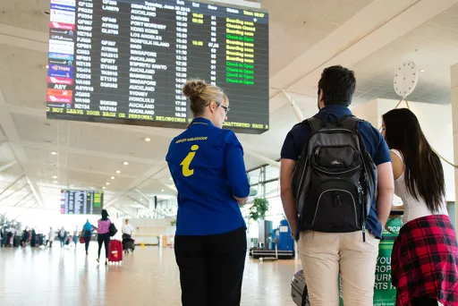 Airport Ambassador assisting passengers 