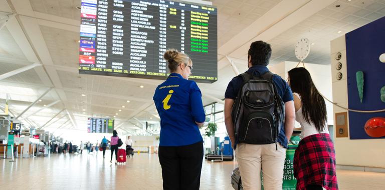 Airport Ambassador assisting passengers 