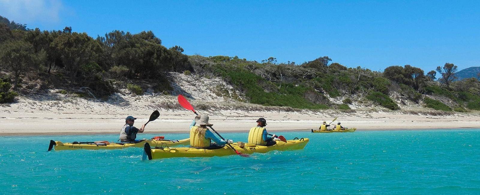 Paddling from beach to beach in Coles Bay, Tasmania | Explore Tasmania's Coles Bay by kayak