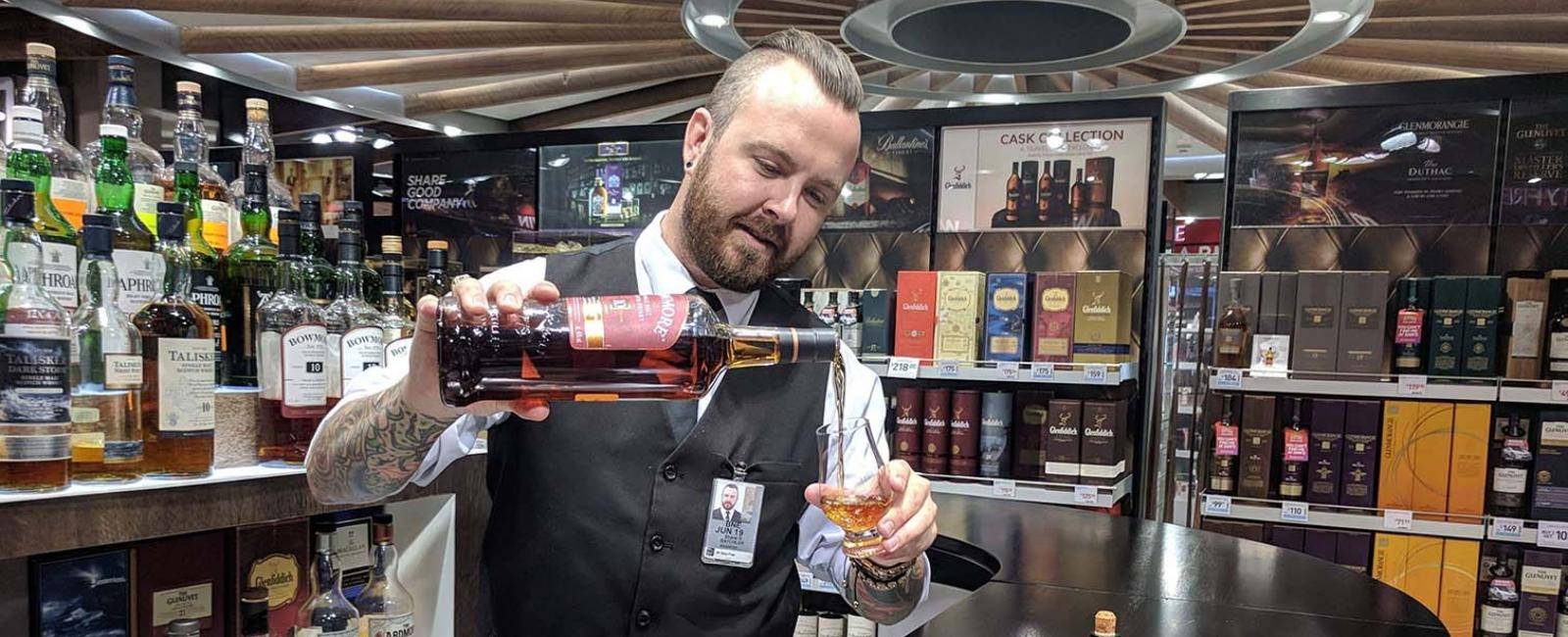Shane Batchler, whisky specialist at Lotte Duty Free’s tasting bar, Brisbane Airport