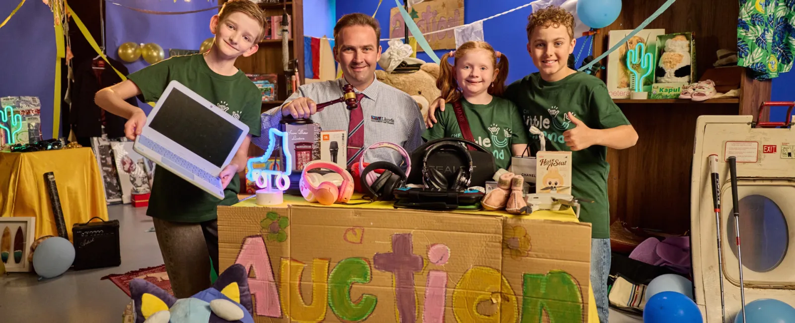 Children's Hospital Foundation kids and Lloyd's auctioneer
