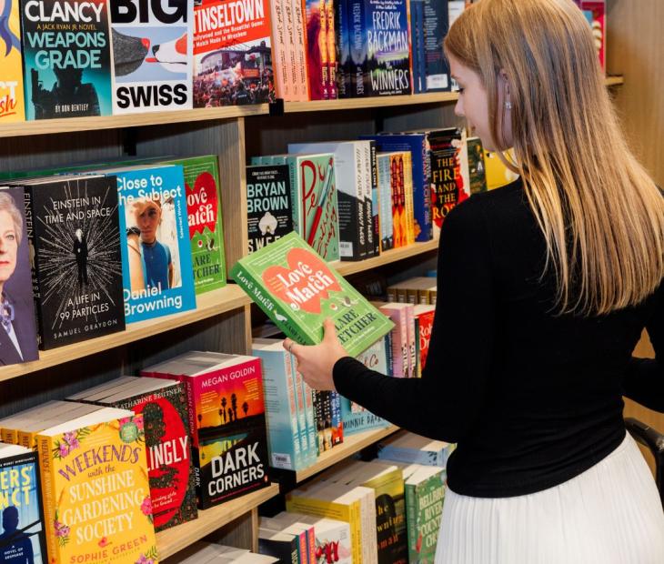Women browsing books in store Women browsing books in store