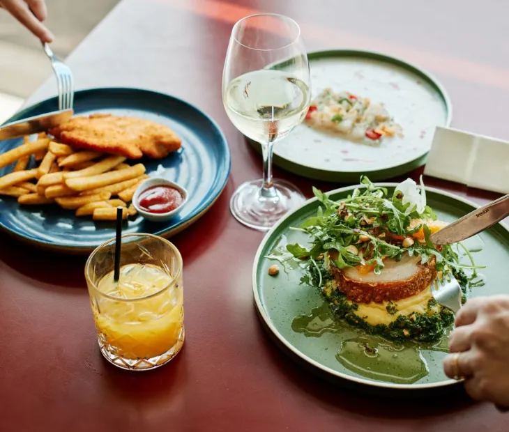 A close up of two peoples meals having lunch