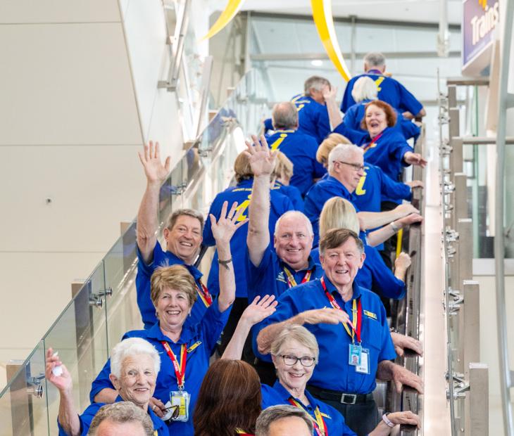Airport ambassadors waving Airport ambassadors waving
