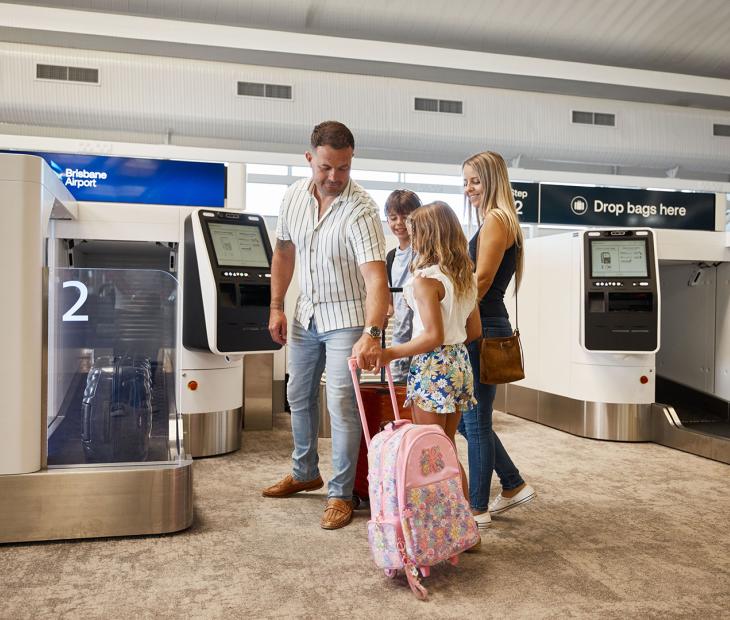 Family at bag drop at International Terminal