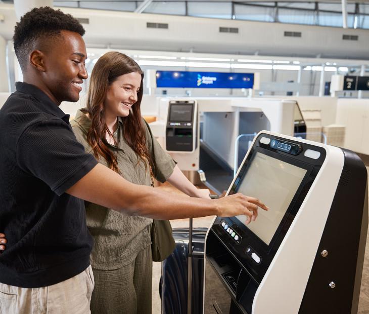 Couple checking in at the International Terminal