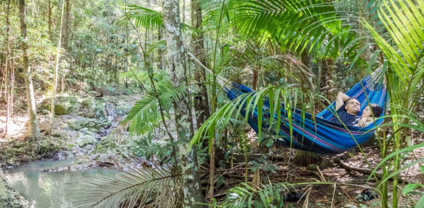 Two people in hammock at Narrows Escape Rainforest Retreat