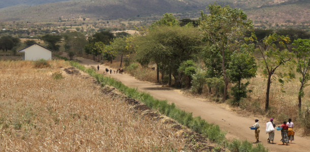 People walking down a road in Tanzania