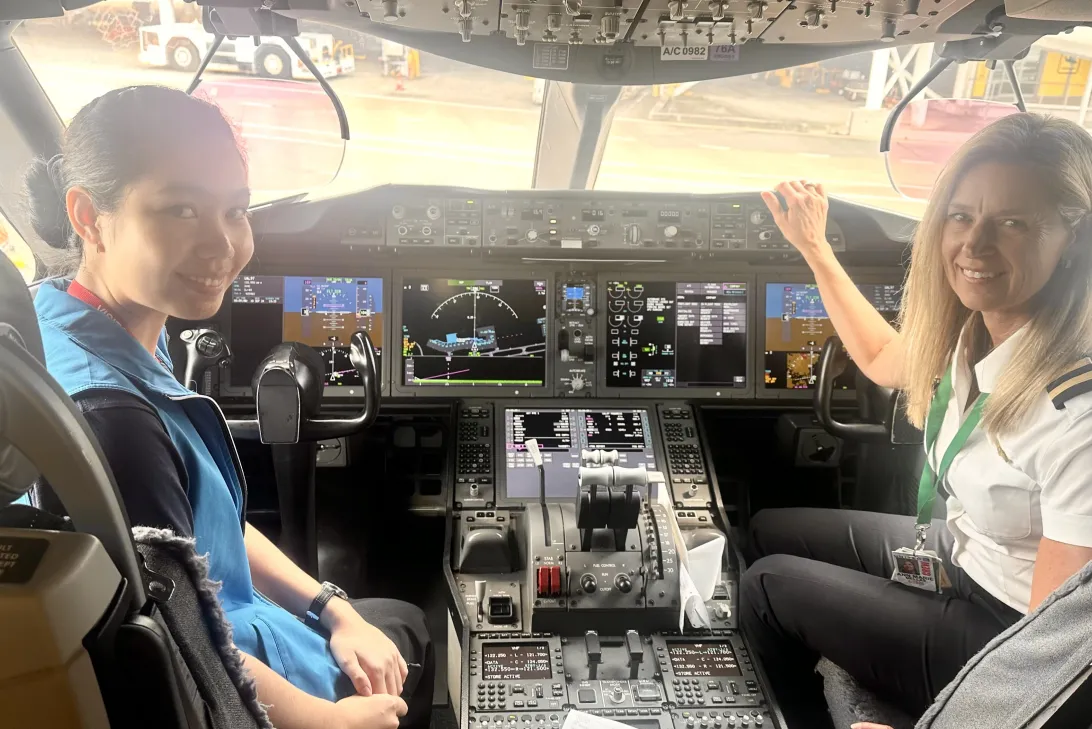 A year 12 student and a pilot in a cockpit