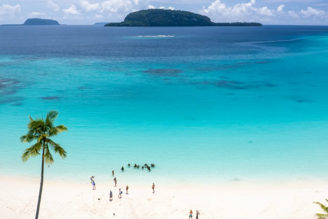 People on Champagne Beach, Santo, Vanuatu